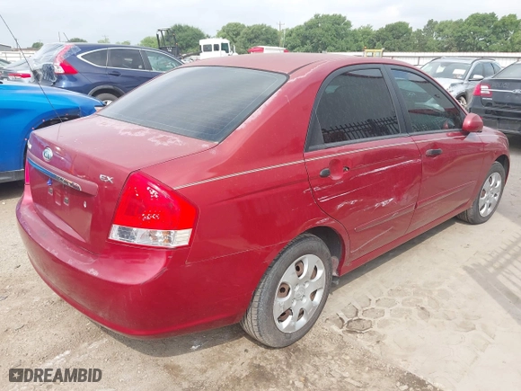 2009 Kia Spectra EX with VIN KNAFE221195606045, listed as a IAAI auction lot 42128548 with 124,577 mi miles. Bid and sale history available at carsss.com. Image 4.
