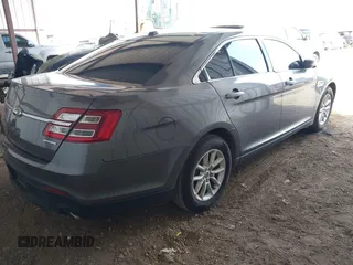 2014 Ford Taurus SE with VIN 1FAHP2D89EG136335, listed as a IAAI auction lot 41880655 with 211,635 mi miles. Bid and sale history available at carsss.com. Image 4.