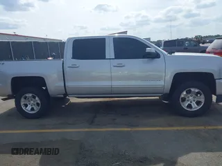 2017 Chevrolet Silverado 1500 LT with VIN 3GCUKREC5HG285689, listed as a IAAI auction lot 42055959 with 128,237 mi miles and . Bid and sale history available at DreamBid. Image 13.