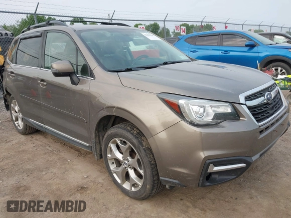 2017 Subaru Forester Touring z VIN JF2SJAWC6HH529707, wystawiony jako IAAI lot #42401138 z przebiegiem 172 868 mil mil oraz . Historia ofert i sprzedaży dostępna na DreamBid. Obrazek 1.
