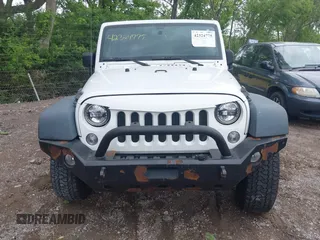 2014 Jeep Wrangler Unlimited Sport with VIN 1C4BJWDG9EL135077, listed as a IAAI auction lot 42324775 with 104,221 mi miles and . Bid and sale history available at DreamBid. Image 12.