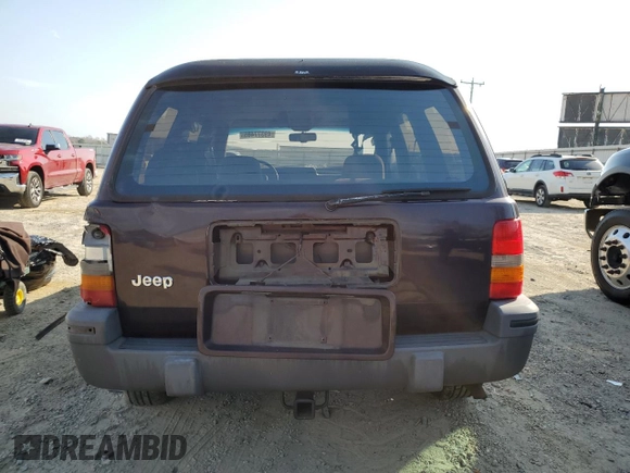 1993 Jeep Grand Cherokee Laredo with VIN 1J4GZ58S8PC656490, listed as a Copart auction lot 49377485 with 236,215 mi miles and Salvage Title. Bid and sale history available at carsss.com. Image 6.