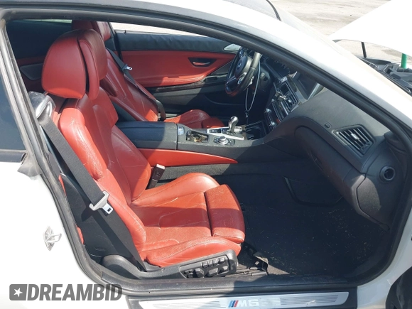 2013 BMW M6 z VIN WBSLX9C52DD159906, wystawiony jako IAAI lot #42095042 z przebiegiem 105 463 mil mil oraz . Historia ofert i sprzedaży dostępna na DreamBid. Obrazek 5.