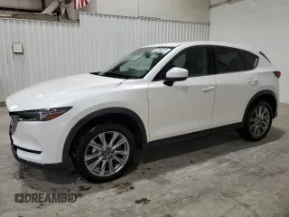 2021 Mazda CX-5 Grand Touring with VIN JM3KFBDM4M1344602, listed as a Copart auction lot 82793724 with 69,322 mi miles and Salvage Title. Bid and sale history available at carsss.com. Image 1.