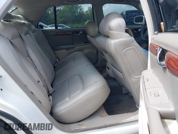 2004 Cadillac DeVille z VIN 1G6KD54YX4U181779, wystawiony jako IAAI lot #41951837 z przebiegiem Nie podano mil oraz . Historia ofert i sprzedaży dostępna na DreamBid. Obrazek 7.