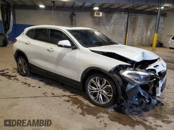 2022 BMW X2 xDrive28i with VIN WBXYJ1C03N5T55985, listed as a Copart auction lot 87183574 with 33,134 mi miles and Salvage Title. Bid and sale history available at carsss.com. Image 4.