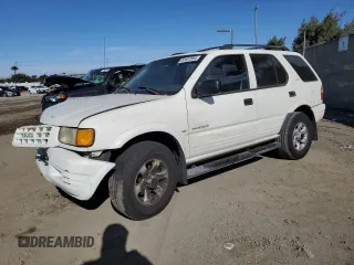 1999 Isuzu Rodeo S with VIN 4S2CK58W4X4302833, listed as a Copart auction lot 87487894 with 179,443 mi miles and Salvage title. Bid and sale history available at DreamBid. Image 1.