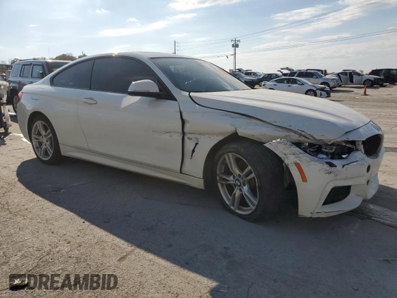 2015 BMW 4 Series 428i xDrive with VIN WBA3N5C5XFK197692, listed as a Copart auction lot 77219684 with 96,148 mi miles and Salvage title. Bid and sale history available at DreamBid. Image 4.