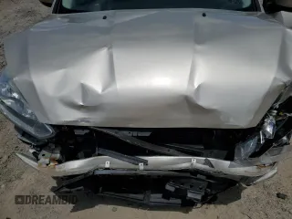 2018 Ford Focus SE z VIN 1FADP3F27JL226890, wystawiony jako Copart lot #56505085 z przebiegiem 112 865 mil mil oraz Szkoda całkowita • Salvage title. Historia ofert i sprzedaży dostępna na DreamBid. Obrazek 11.