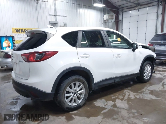 2014 Mazda CX-5 Touring with VIN JM3KE4CY4E0349034, listed as a IAAI auction lot 41478954 with 117,502 mi miles. Bid and sale history available at carsss.com. Image 4.