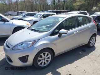 2013 Ford Fiesta SE with VIN 3FADP4EJ3DM136332, listed as a IAAI auction lot 42142556 with 69,979 mi miles and . Bid and sale history available at DreamBid. Image 2.