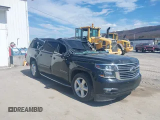 2015 Chevrolet Suburban LTZ with VIN 1GNSKKKC9FR280390, listed as a IAAI auction lot 41882449 with 80,499 mi miles and . Bid and sale history available at DreamBid. Image 1.