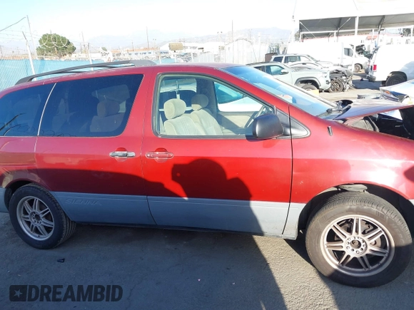2002 Toyota Sienna CE with VIN 4T3ZF19C12U438162, listed as a IAAI auction lot 41725040 with 241,080 mi miles. Bid and sale history available at carsss.com. Image 14.