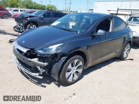 2024 Tesla Model Y with VIN 7SAYGDED2RF040745, listed as a IAAI auction lot 41986613 with 9,778 mi miles and . Bid and sale history available at DreamBid. Image 21.