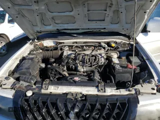 2003 Mitsubishi Montero z VIN JA4MT41RX3J013246, wystawiony jako Copart lot #42210545 z przebiegiem 188 387 mil mil oraz Szkoda całkowita • Salvage title. Historia ofert i sprzedaży dostępna na DreamBid. Obrazek 11.