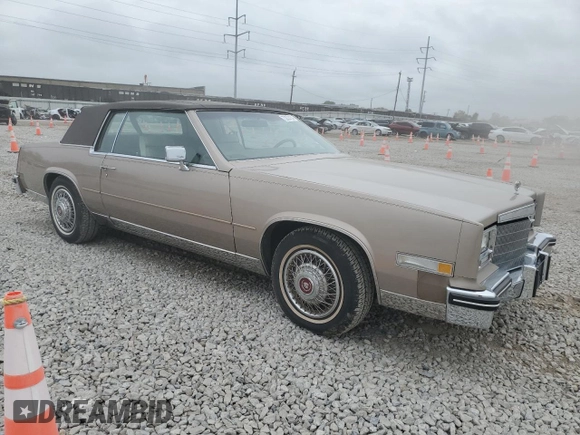 1985 Cadillac Eldorado z VIN 1G6EL5788FE655155, wystawiony jako Copart lot #73223134 z przebiegiem 68 676 mil mil oraz Tytuł czysty. Historia ofert i sprzedaży dostępna na DreamBid. Obrazek 4.