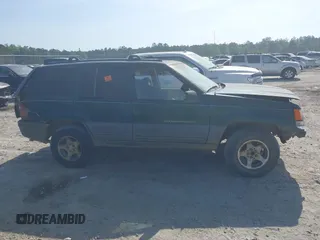 1996 Jeep Grand Cherokee Laredo with VIN 1J4FX58S9TC300710, listed as a IAAI auction lot 42073391 with 1 mi miles. Bid and sale history available at carsss.com. Image 13.