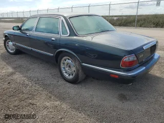 1999 Jaguar XJ with VIN SAJKX6047XC861227, listed as a Copart auction lot 75007414 with 0 mi miles and Salvage Title. Bid and sale history available at carsss.com. Image 2.