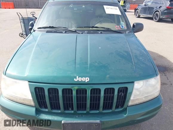 1999 Jeep Grand Cherokee Limited with VIN 1J4GW68N4XC544651, listed as a IAAI auction lot 41742346 with 94,904 mi miles and . Bid and sale history available at DreamBid. Image 6.