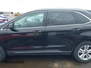 2020 Ford Edge SEL z VIN 2FMPK4J9XLBA78278, wystawiony jako IAAI lot #42181490 z przebiegiem 236 730 mil mil oraz . Historia ofert i sprzedaży dostępna na DreamBid. Obrazek 14.