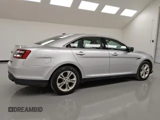 2016 Ford Taurus SE z VIN 1FAHP2D88GG126947, wystawiony jako Copart lot #55256955 z przebiegiem 88 821 mil mil oraz Czysty tytuł • Clean title. Historia ofert i sprzedaży dostępna na DreamBid. Obrazek 3.