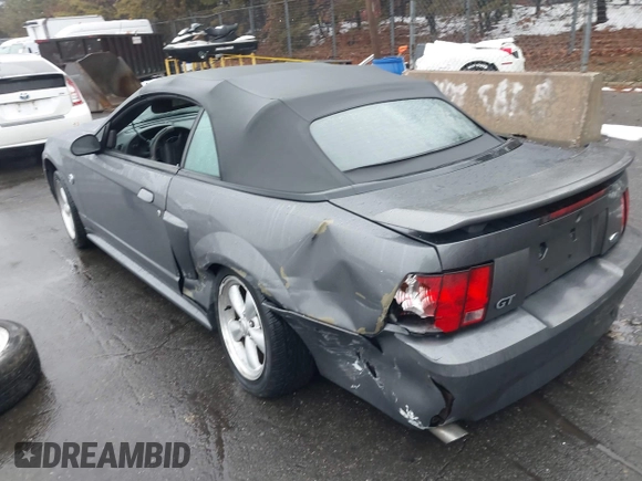 2004 Ford Mustang GT Deluxe z VIN 1FAFP45X74F128442, wystawiony jako IAAI lot #41580930 z przebiegiem 100 801 mil mil oraz . Historia ofert i sprzedaży dostępna na DreamBid. Obrazek 3.