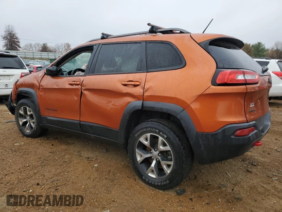 2015 Jeep Cherokee Trailhawk z VIN 1C4PJMBS7FW704980, wystawiony jako Copart lot #70334472 z przebiegiem 127 562 mil mil oraz Szkoda całkowita • Salvage title. Historia ofert i sprzedaży dostępna na DreamBid. Obrazek 2.