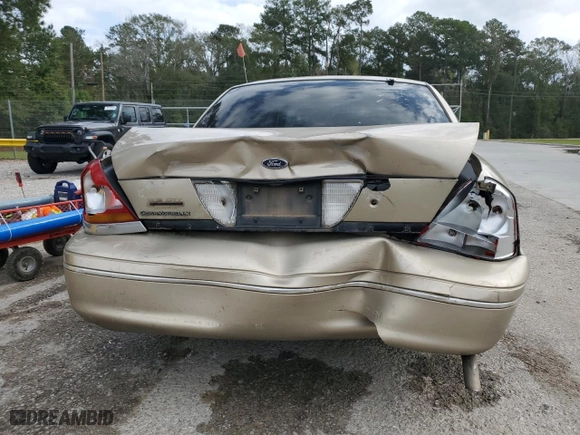 2000 Ford Crown Victoria LX with VIN 2FAFP74W7YX117705, listed as a Copart auction lot 79226944 with 128,019 mi miles and Salvage Title. Bid and sale history available at carsss.com. Image 6.