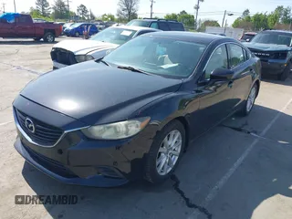 2016 Mazda Mazda6 i Sport with VIN JM1GJ1U54G1422560, listed as a IAAI auction lot 41935881 with 87,030 mi miles. Bid and sale history available at carsss.com. Image 2.