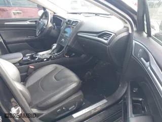 2014 Ford Fusion Energi Titanium with VIN 3FA6P0SU5ER269923, listed as a IAAI auction lot 41086950 with 135,351 mi miles. Bid and sale history available at carsss.com. Image 5.