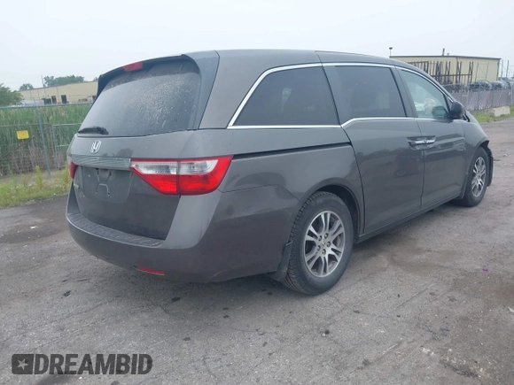 2011 Honda Odyssey EX-L with VIN 5FNRL5H64BB029087, listed as a IAAI auction lot 42508764 with 214,705 mi miles and . Bid and sale history available at DreamBid. Image 4.