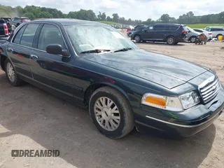 2003 Ford Crown Victoria LX z VIN 2FAFP74WX3X184730, wystawiony jako IAAI lot #42264132 z przebiegiem 297 561 mil mil oraz . Historia ofert i sprzedaży dostępna na DreamBid. Obrazek 1.