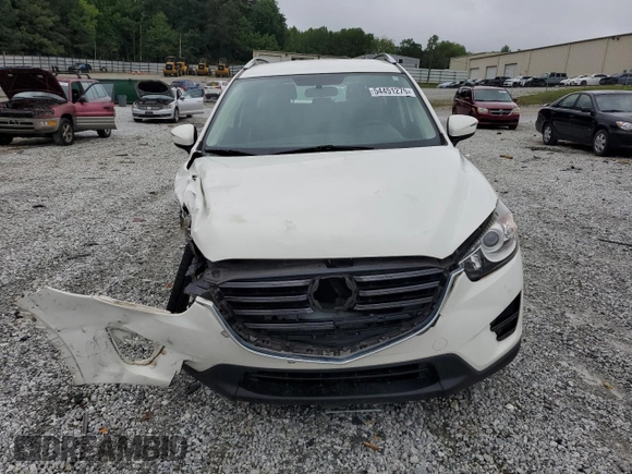 2016 Mazda CX-5 Sport with VIN JM3KE2BY0G0843786, listed as a Copart auction lot 54451275 with 111,363 mi miles and Salvage title. Bid and sale history available at DreamBid. Image 5.