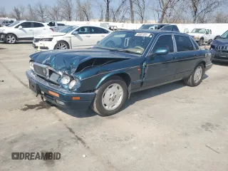 1996 Jaguar XJ with VIN SAJHX1746TC756451, listed as a Copart auction lot 48991655 with 115,015 mi miles and Salvage title. Bid and sale history available at DreamBid. Image 1.