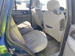 2004 GMC Envoy SLE with VIN 1GKDT13S242391968, listed as a IAAI auction lot 42079420 with 234,611 mi miles. Bid and sale history available at carsss.com. Image 8.