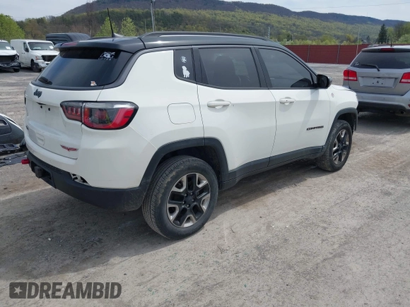 2017 Jeep Compass Trailhawk with VIN 3C4NJDDBXHT500588, listed as a IAAI auction lot 42060556 with 76,788 mi miles and . Bid and sale history available at DreamBid. Image 4.