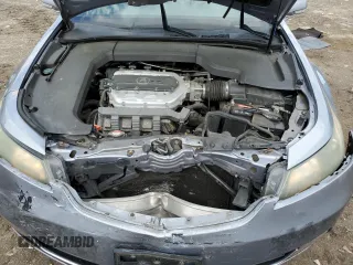 2012 Acura TL Technology z VIN 19UUA8F55CA007705, wystawiony jako Copart lot #53231695 z przebiegiem 189 761 mil mil oraz Szkoda całkowita • Salvage title. Historia ofert i sprzedaży dostępna na DreamBid. Obrazek 12.