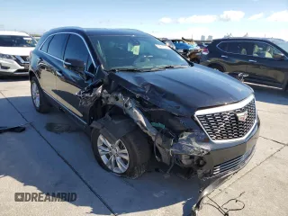 2022 Cadillac XT5 FWD Luxury with VIN 1GYKNAR45NZ118872, listed as a Copart auction lot 79676544 with 31,467 mi miles and Salvage title. Bid and sale history available at DreamBid. Image 4.