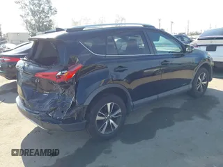 2016 Toyota RAV4 XLE with VIN 2T3RFREV6GW459313, listed as a IAAI auction lot 42074337 with 149,914 mi miles and . Bid and sale history available at DreamBid. Image 4.