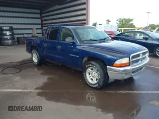 2001 Dodge Dakota Sport with VIN 1B7GL2AX01S133957, listed as a IAAI auction lot 41644558 with 156,008 mi miles. Bid and sale history available at carsss.com. Image 1.