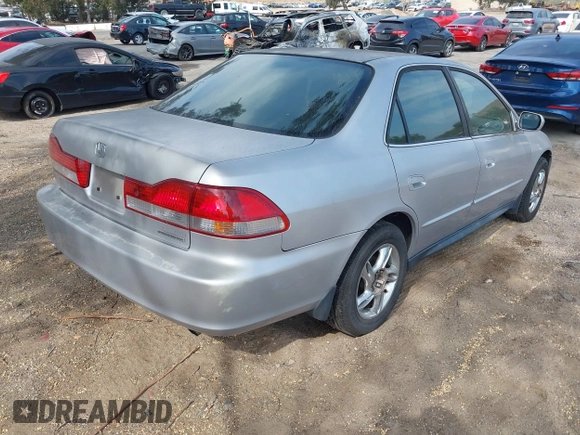 2002 Honda Accord SE z VIN JHMCG66802C027742, wystawiony jako IAAI lot #42373110 z przebiegiem 141 167 mil mil oraz . Historia ofert i sprzedaży dostępna na DreamBid. Obrazek 4.