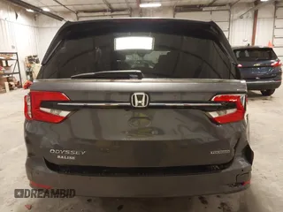 2021 Honda Odyssey Touring with VIN 5FNRL6H82MB025923, listed as a IAAI auction lot 42104290 with 61,178 mi miles and . Bid and sale history available at DreamBid. Image 17.