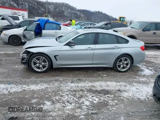 2016 BMW 4 Series 428i xDrive with VIN WBA4C9C53GG136870, listed as a IAAI auction lot 41410071 with 116,187 mi miles and . Bid and sale history available at DreamBid. Image 14.