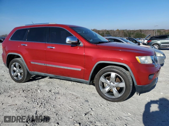 2011 Jeep Grand Cherokee Overland with VIN 1J4RS6GG7BC665979, listed as a Copart auction lot 83394214 with 216,988 mi miles and Salvage Title. Bid and sale history available at DreamBid. Image 4.