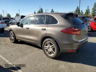 2014 Porsche Cayenne S Hybrid with VIN WP1AE2A2XELA50071, listed as a Copart auction lot 83904494 with 76,436 mi miles and Salvage title. Bid and sale history available at DreamBid. Image 2.