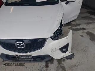 2014 Mazda CX-5 Touring with VIN JM3KE4CY9E0370610, listed as a IAAI auction lot 42016896 with 72,340 mi miles. Bid and sale history available at carsss.com. Image 6.