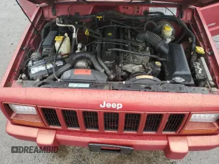 1999 Jeep Cherokee Sport with VIN 1J4FT68S1XL601799, listed as a Copart auction lot 83881844 with 203,572 mi miles and Salvage title. Bid and sale history available at DreamBid. Image 13.