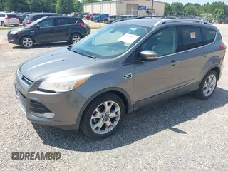 2014 Ford Escape Titanium z VIN 1FMCU0JX3EUA26519, wystawiony jako IAAI lot #42553081 z przebiegiem 108 052 mil mil oraz . Historia ofert i sprzedaży dostępna na DreamBid. Obrazek 2.
