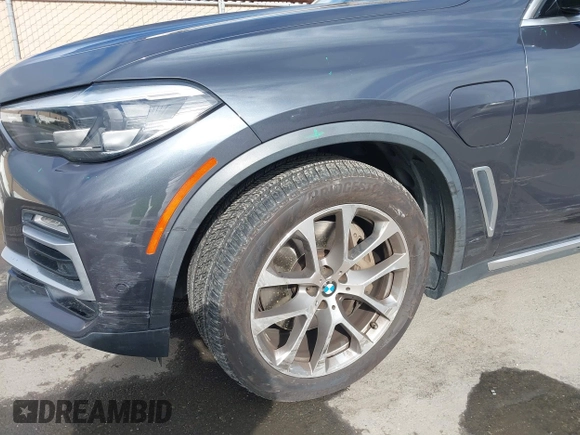 2021 BMW X5 xDrive45e with VIN 5UXTA6C09M9D26035, listed as a IAAI auction lot 41788981 with 60,571 mi miles and . Bid and sale history available at DreamBid. Image 6.