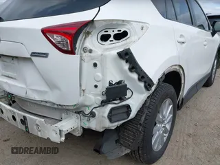 2015 Mazda CX-5 Touring with VIN JM3KE4CY4F0488484, listed as a IAAI auction lot 42115093 with 156,344 mi miles. Bid and sale history available at carsss.com. Image 6.